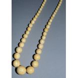 AN IVORY ONE HUNDRED BEAD NECKLACE.