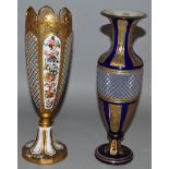 A BOHEMIAN GILT AND WHITE OVERLAY VASE painted with panels of flowers, 9.5ins high (AF) and a BLUE