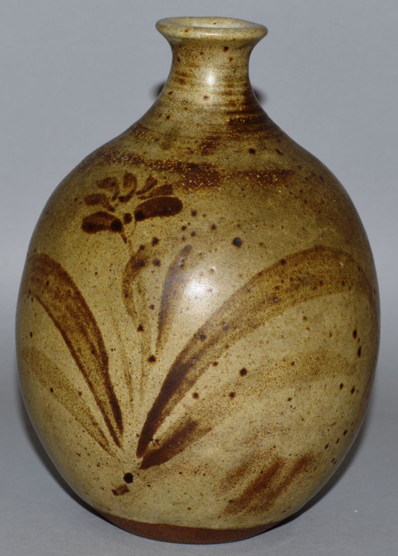 A POTTERY STUDIO BULBOUS VASE with Japanese style decoration, leaves and flowers.