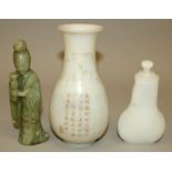A CHINESE WHITE JADE-LIKE VASE & COVER, the sides decorated with taotie masks below stiff leaves,