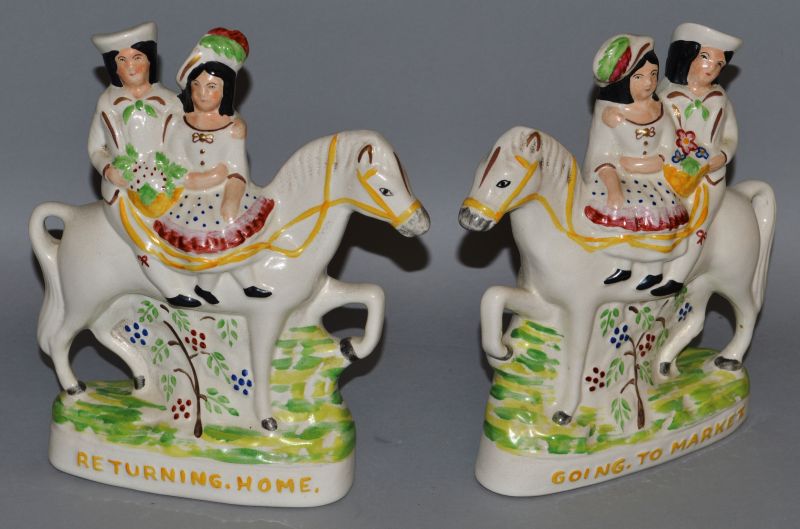 A PAIR OF STAFFORDSHIRE GROUPS, “GOING TO MARKET” and “RETURNING HOME”. 8ins high.