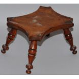 A TREEN SHAPED CANDLESTAND on four turned legs. 6ins high.