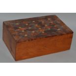 A YEW WOOD JEWELLERY BOX with inlaid lid and fitted interior. 9.5ins wide.