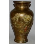 A CHINESE BRONZE VASE decorated with birds and chrysanthemums in relief. 10ins high.