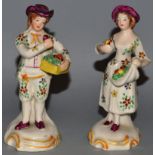 A SMALL PAIR OF STAFFORDSHIRE PEARLWARE FIGURES OF A YOUNG MAN AND LADY carrying a basket and