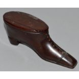 A TREEN WOODEN SHOE SNUFF BOX. 4ins long.