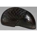 A CARVED WOOD NETSUKE, a carp.