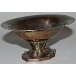 A GEORGE JENSEN STERLING OVAL HAMMERED SWEETMEAT DISH on a ten sided base. 5ins wide.