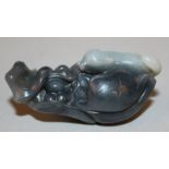 A CHINESE WHITE & GREY JADE LIKE MODEL OF A RAT, on leaf-shrouded grapes, 2.75in long.