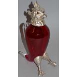 A GOOD PARROT RUBY GLASS CLARET JUG with plated head, glass eyes and feet. 10.5ins high.