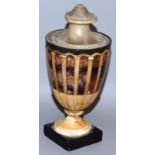 A REGENCY MARBLE AND BLUE JOHN URN AND LID with sixteen Blue John panels on a square base. 8ins high