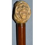 A CANE with carved ivory EGYPTIANS HEAD. 35ins long.