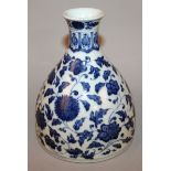 A CHINESE MING-STYLE BLUE & WHITE PORCELAIN VASE, of unusual form, decorated with formal scrolling