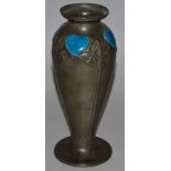 A LIBERTY & CO TUDRIC PEWTER VASE of tapering oviform rising on a circular base, the body