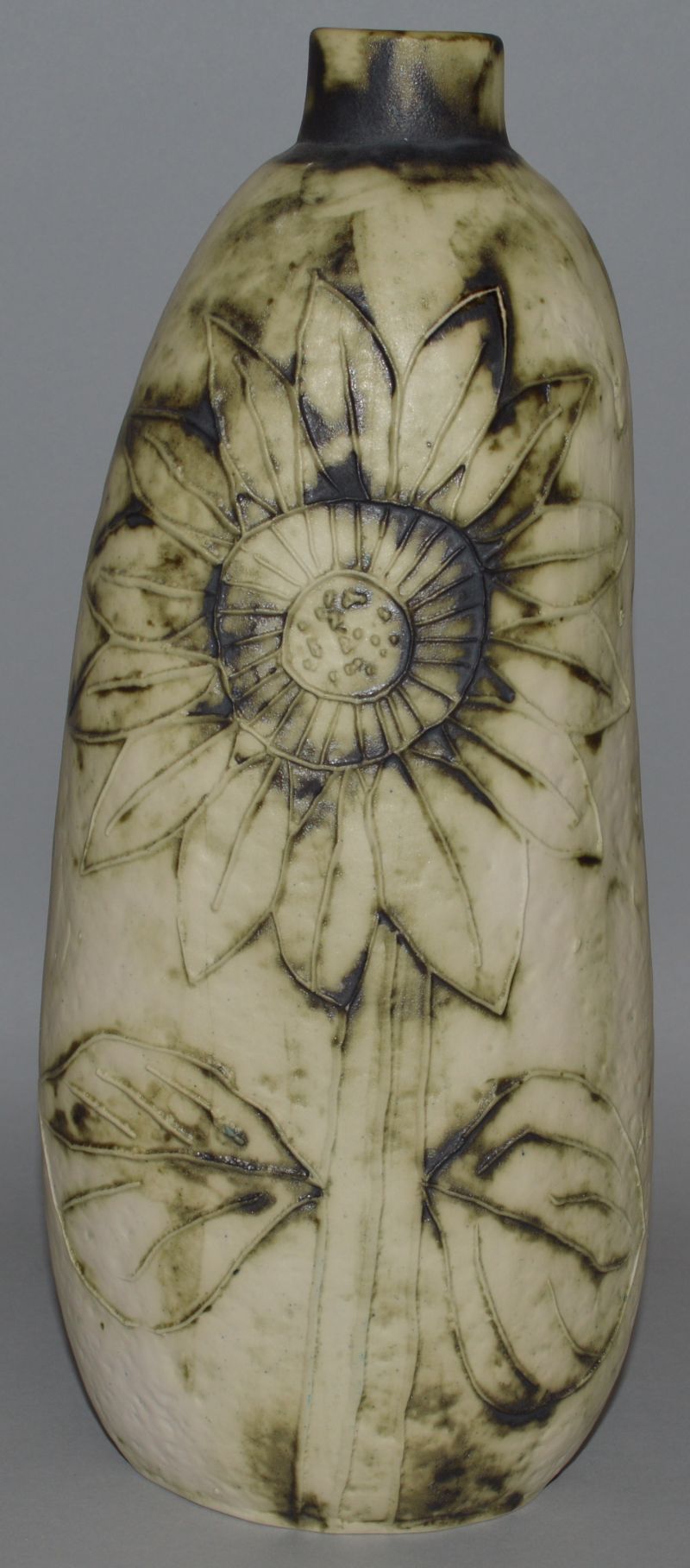 A CARN POTTERY PENZANCE CORNWALL VASE by JOHN BEUSMANS decorated with sunflowers. Signed. 11ins