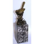 MILO A GOOD BRONZE OF “JENNY WREN” on a tree stump. Signed. 6.25ins high, on a marble plinth.