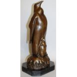 MILO A BRONZE PENGUIN WITH CHICK. 13.5ins high.