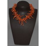 A CORAL SINGLE STRAND NECKLACE.