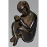 A CARVED WOOD NETSUKE, a nude woman.