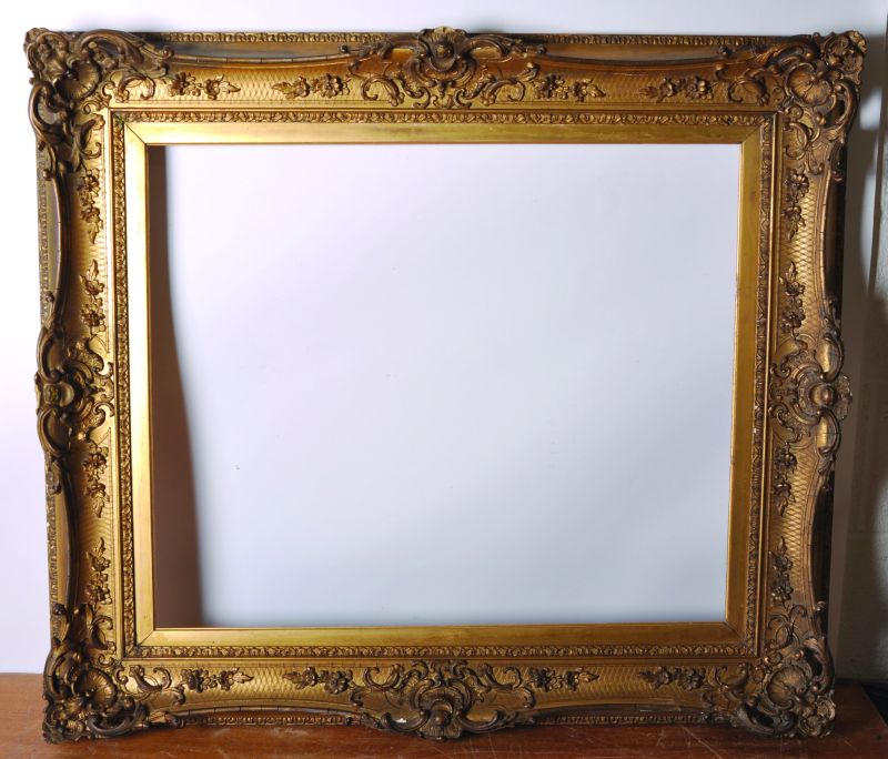 19th Century English School. A Gilt Composition Frame, with Pierced Centres and Corners, 30” x 25”.