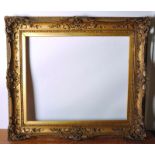 19th Century English School. A Gilt Composition Frame, with Pierced Centres and Corners, 30” x 25”.