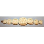 A GOOD QUALITY 19TH CENTURY CHINESE CANTON IVORY BRACELET, each graduated section carved in deep