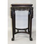 AN EARLY 20TH CENTURY TALL CHINESE CARVED HARDWOOD MARBLE-TOP STAND, with carved foliate frieze, 2ft