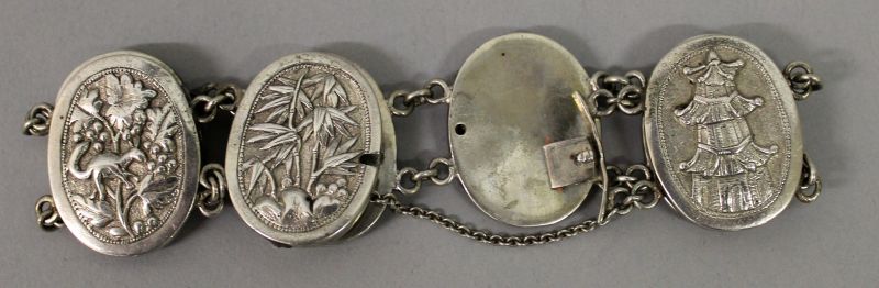AN UNUSUAL SILVER-METAL BRACELET, in the form of dimes onlaid with auspicious Chinese characters, - Image 4 of 4