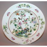 A GOOD QUALITY CHINESE FAMILLE ROSE PORCELAIN PLATE, the interior painted with a peach tree