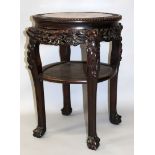 A LATE 19TH CENTURY CHINESE CARVED HARDWOOD MARBLE-TOP TWO TIER STAND, with carved foliate frieze on