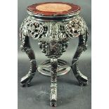 A 19TH CENTURY CHINESE CARVED HARDWOOD MARBLE TOP STAND, the pierced frieze carved with panels of