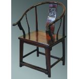 AN 18TH CENTURY CHINESE HUANGHUALI TYPE HOOP BACK CHAIR, the solid splat carved with a panel of a