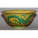 A CHINESE GREEN & YELLOW ENAMELLED DRAGON BOWL, the exterior sides decorated with a dragon