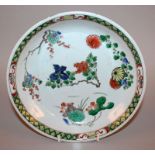 A CHINESE KANGXI PERIOD FAMILLE VERTE PORCELAIN SAUCER DISH, circa 1700, the interior painted with