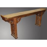 A LONG 18TH/19TH CENTURY OAK ALTER TABLE, with plain top, rising ends, pierced carving and pierced