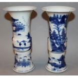 A PAIR OF 19TH CENTURY CHINESE BLUE & WHITE PORCELAIN GU VASES, each painted with a river