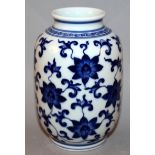 A CHINESE BLUE & WHITE PORCELAIN VASE, the sides decorated with an overall design of scroll-