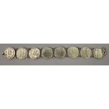 AN UNUSUAL SILVER-METAL BRACELET, in the form of dimes onlaid with auspicious Chinese characters,