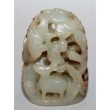 A CHINESE CELADON JADE CARVING OF DEER AND STORKS, in a grove of bamboo, pine and lingzhi, the stone