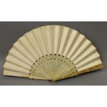 A LARGE 19TH CENTURY CHINESE CANTON IVORY FAN, with sixteen thin interior sticks, the plain silk