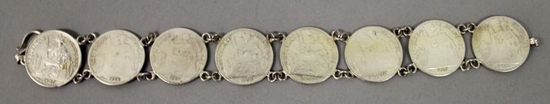 AN UNUSUAL SILVER-METAL BRACELET, in the form of dimes onlaid with auspicious Chinese characters, - Image 2 of 4