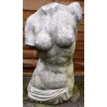 A RECONSTITUTED STONE FEMALE TORSO. 1ft 9ins high.