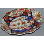 AN 18TH CENTURY WORCESTER SHAPED DISH painted in imari style with the rare Pavilion pattern See