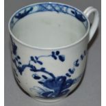 AN 18TH CENTURY WORCESTER COFFEE CUP, painted in blue with a prunus tree rock and fence, a bird