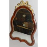 A ROSEWOOD SHAPED EASEL MIRROR. 18ins high.