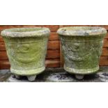 A PAIR OF RECONSTITUTED STONE CIRCULAR PLANTERS with moulded decoration. 1ft 2ins high.