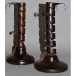 A PAIR OF IRON AND STEEL TWIST CANDLESTICKS.