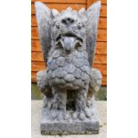 A RECONSTITUTED STONE MODEL OF A DRAGON. 2ft 0ins high.