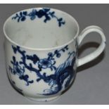 AN 18TH CENTURY WORCESTER COFFEE CUP, painted in blue with the Prunus Root pattern workman's mark.