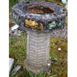 A SMALL RECONSTITUTED OCTAGONAL SHAPE BIRD BATH. 2ft 0ins high.